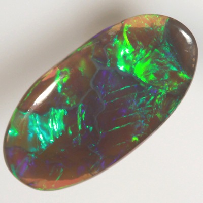 SOLID BLACK CRYSTAL OPAL Rolling flashes of golden green